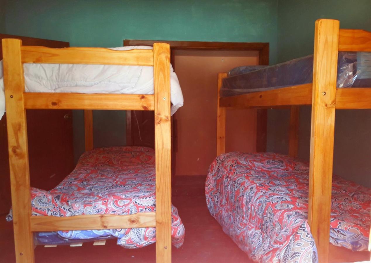 Cama en habitación compartida con 4 camas